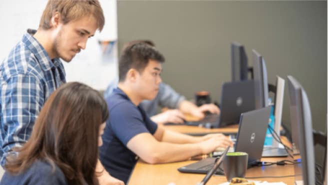 Employees collaborating in co-working space