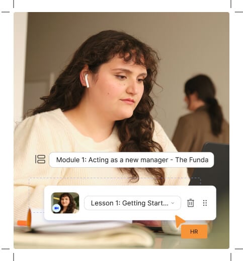 A focused young woman wearing headphones sits at her desk, engaging with an online learning module titled 'Acting as a new manager - The Fundamentals' displayed on her laptop. The interface shows a lesson called 'Getting Started...' highlighted, indicating an active session on internal training simplified through Workleap's Learning Management System.